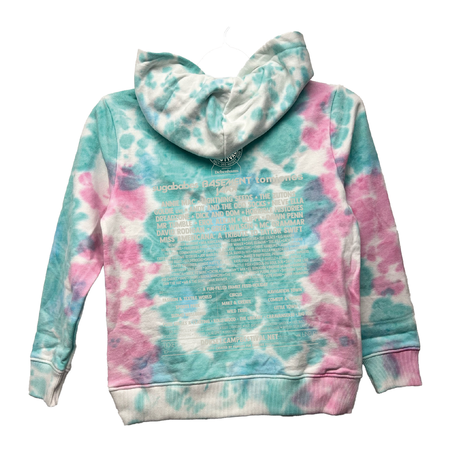 The Camp Bestival 2025 Kids Hoodie by 2025 features a blue and pink tie-dye design with white text in various font sizes printed on the back. Shown on a hanger with the hood up.