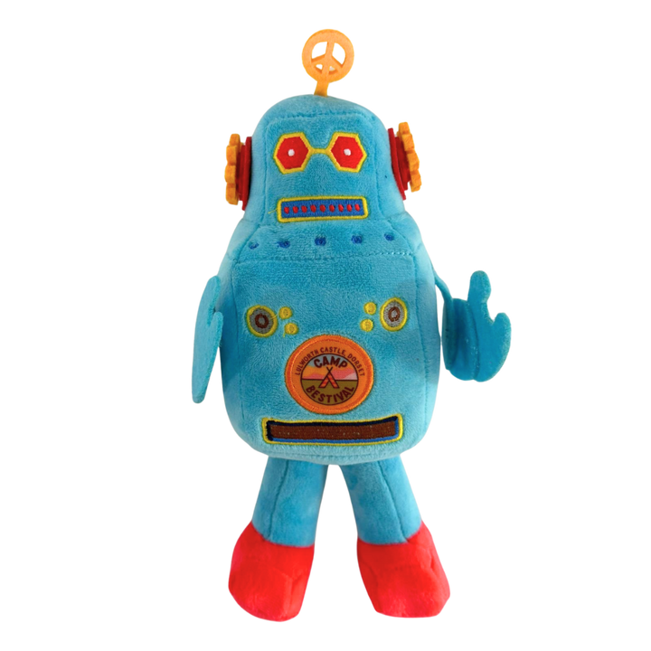 The Camp Bestival Love-Bot Plush by 2025 is a blue robot toy with red feet, orange ear-like sides, hexagonal red eyes, a circular belly emblem, a yellow top antenna, and one arm raised in a wave.