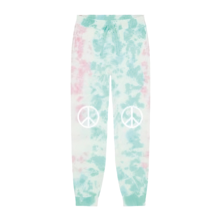 The Camp Bestival Joggers by 2025 are pastel tie-dye sweatpants in light blue, pink, and white, featuring white peace symbol graphics on each knee.