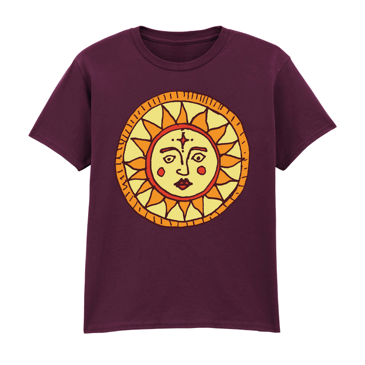 The Camp Bestival Kids T-Shirt Sun by 2025 features a maroon color with a large, stylized yellow and orange sun with a human face, red cheeks, and geometric rays centered on the chest.